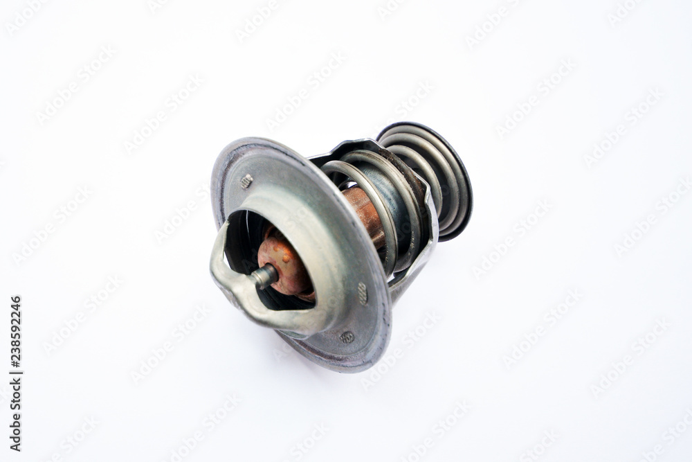 Broken thermostat of the car on an isolated white background Broken thermostat of the car on an isolated white background