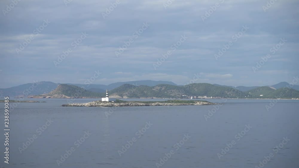 View to an ibiza lighthouse sailing from the boat View to an ibiza lighthouse sailing from the boat