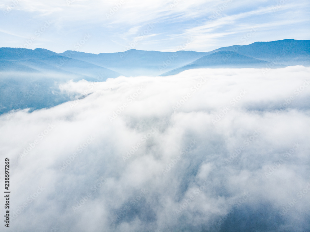 aerial view of clods and fog over mountains hills. magic time aerial view of clods and fog over mountains hills. magic time
