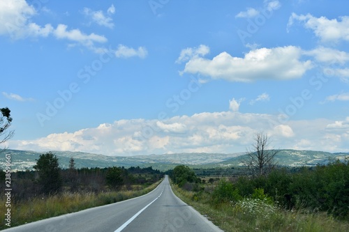 Country road on sunny summer day, nature landscape.  photo