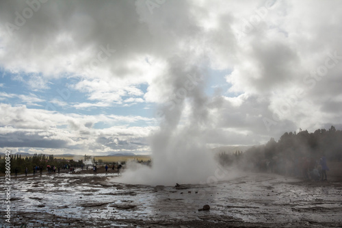 Geysir Strokkur in Iceland erupts on cloudy day