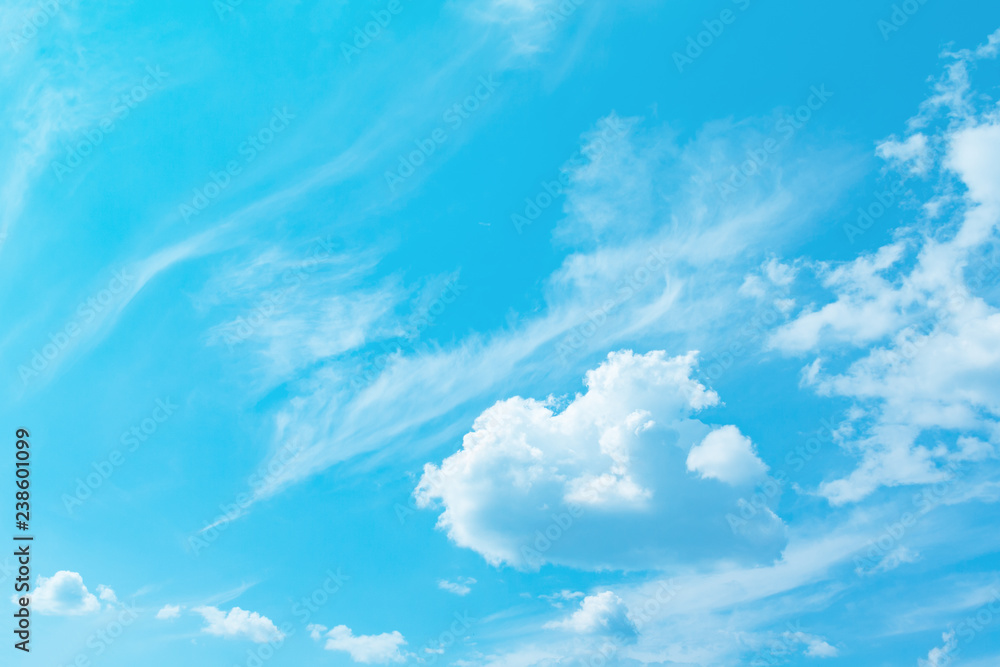 View on a white fluffy cloud in bright turquoise sky as background View on a white fluffy cloud in bright turquoise sky as background