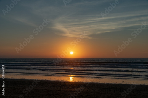 No people with a golden sunset over the Atlantic Ocean from Agadir Beach, Morocco, Africa
