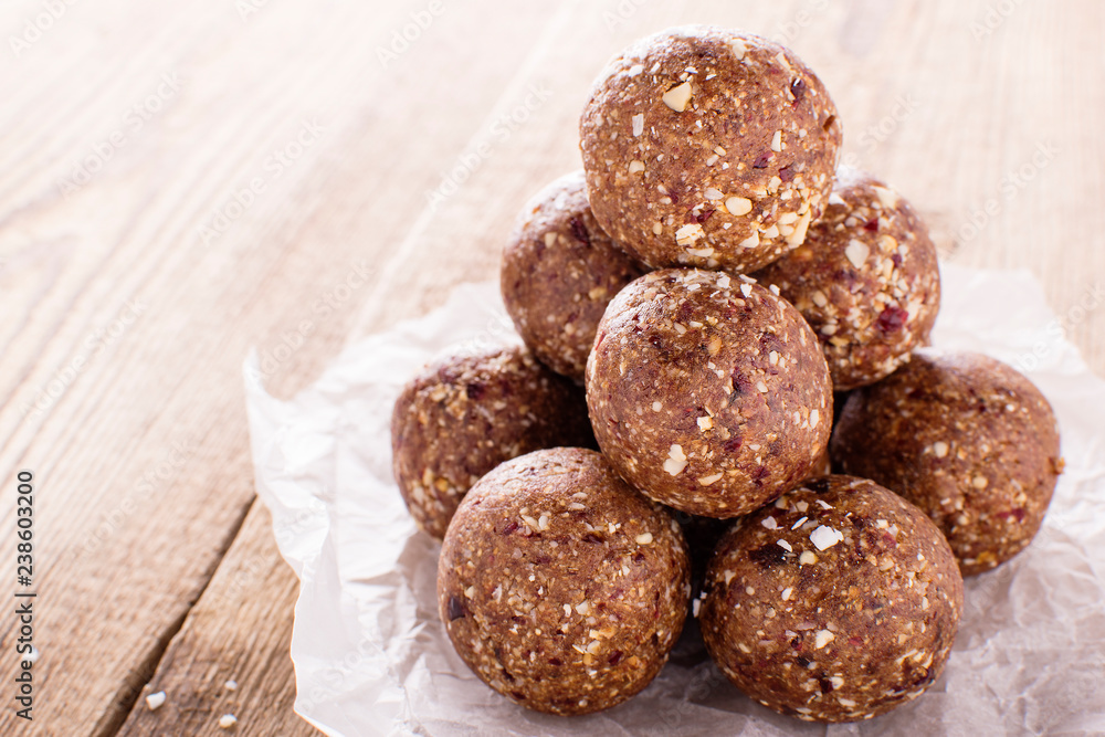 nutty chocolate energy balls on parchment paper nutty chocolate energy balls on parchment paper