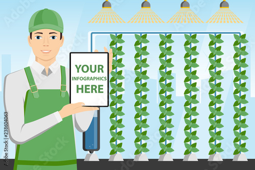 Modern farmer with tablet computer in a greenhouse. White screen, you can add your infographic here.
