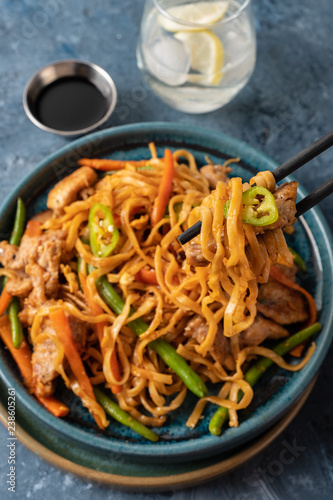 Asian noodles with pork in teriyaki sauce, with green beans, carrots and shiitake mushrooms.