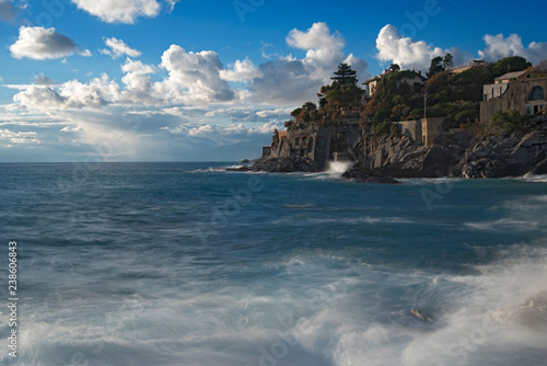 Rocky cliffs and surf along the coast at Bogliasco photo