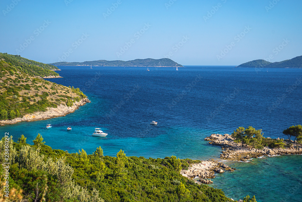 Aerial seascape view to turquoise waters of Adriatic Sea and islands in the distance, near town Dubrovnik in Croatia. Famous sailing travel destination in Croatia, Dubrovnik summer scenery in Europe. Aerial seascape view to turquoise waters of Adriatic Sea and islands in the distance, near town Dubrovnik in Croatia. Famous sailing travel destination in Croatia, Dubrovnik summer scenery in Europe.