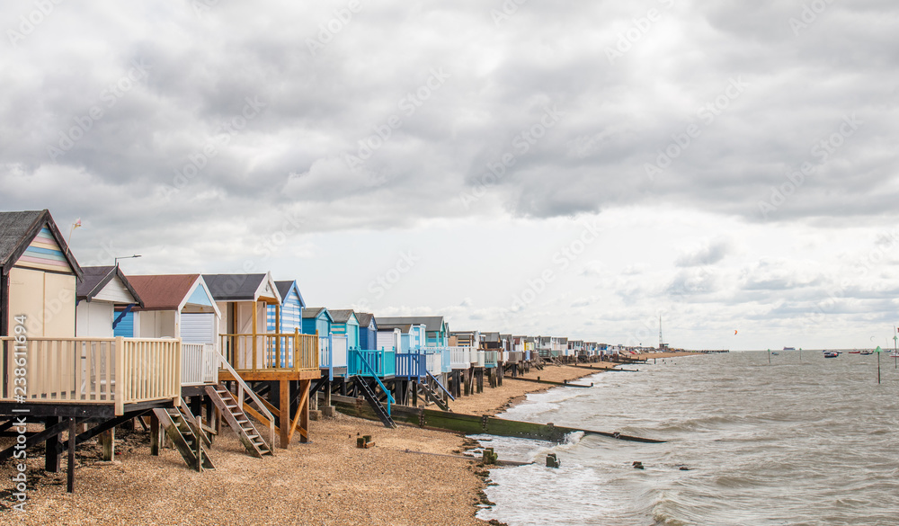 UK beach huts on the sea shore