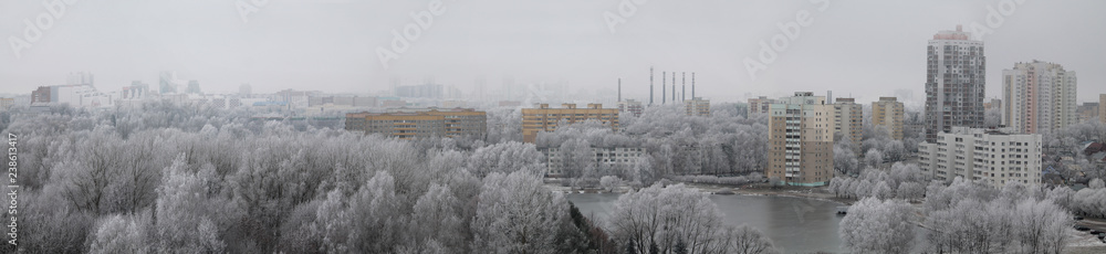 Panoramic view of a winter cityscape with white trees covered in frost. View from high above, Minsk, Belarus