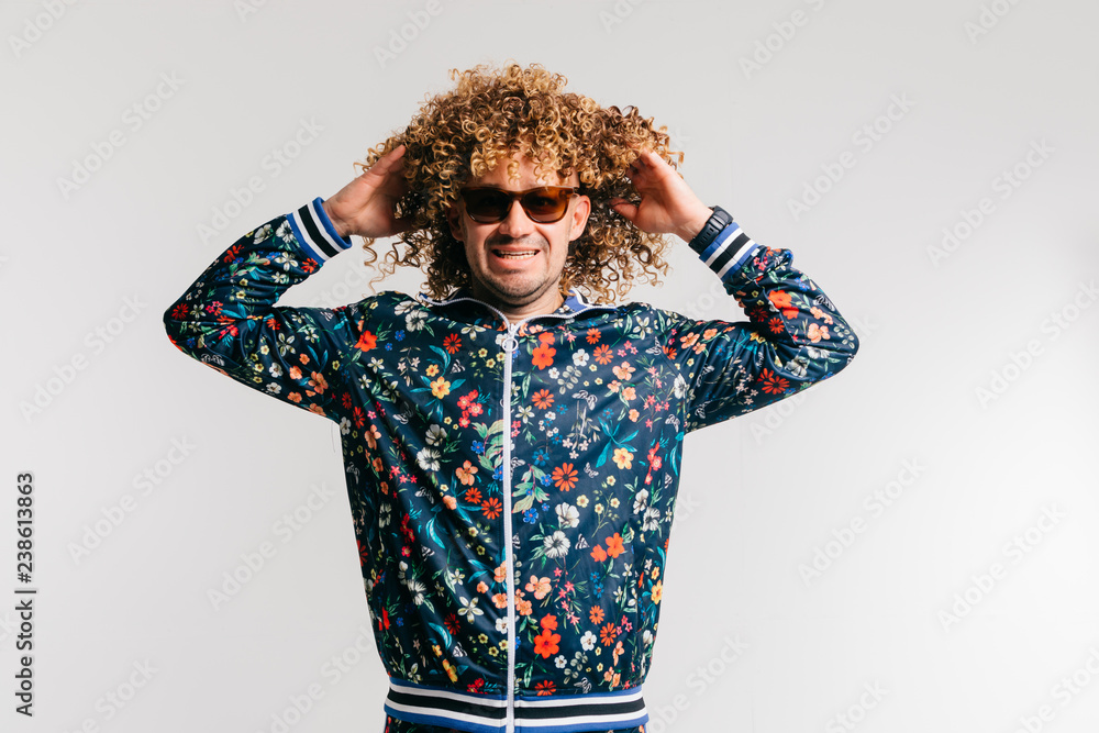Adult shylish funky man in fashion clothes, posing on white studio  background. Excited bizarre crazy shocked male shouting, tearing hair.  Surprised funny happy young brazilian guy screaming. Stock Photo | Adobe  Stock