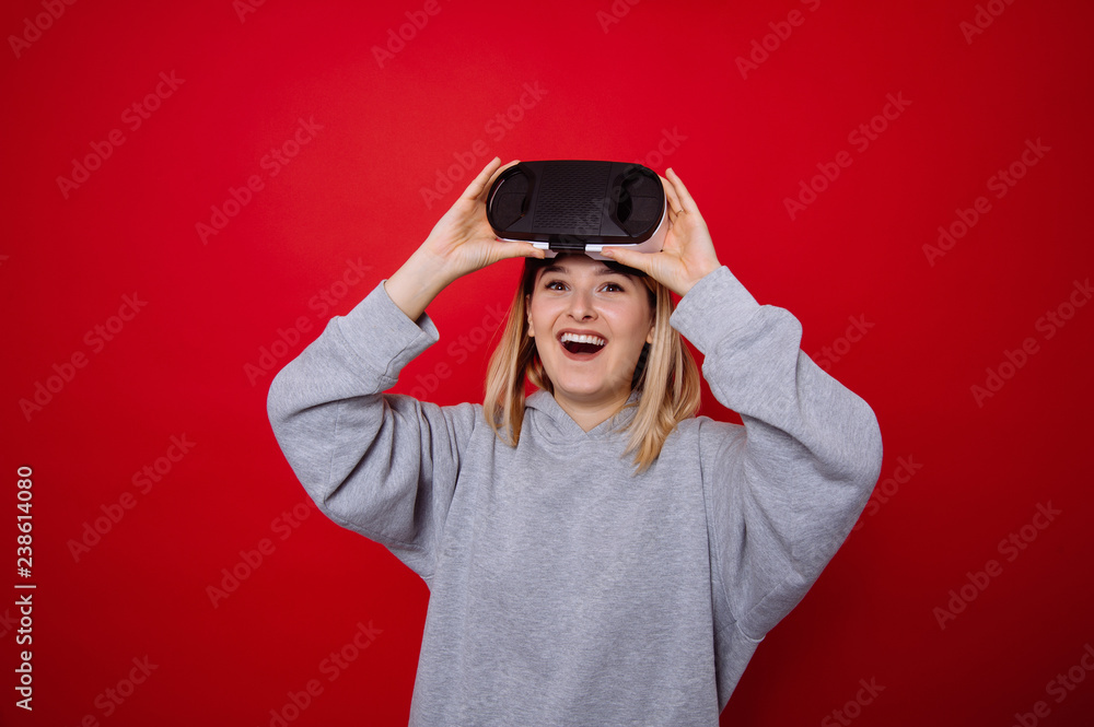 Portrait of amazed young woman wearing VR helmet Portrait of amazed young woman wearing VR helmet