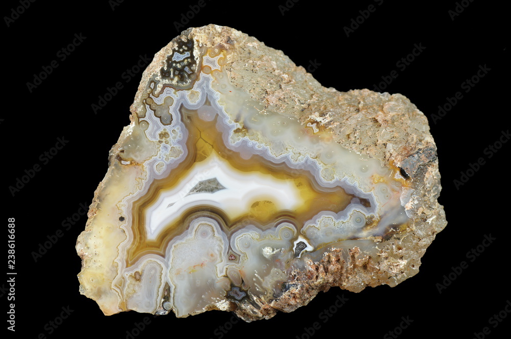 A cross-section of agate. Multicolored silica bands colored with metal oxides are visible. Origin: Agouin, Atlas mountains, Morocco.