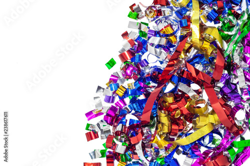 Confetti on white background.  Texture of confetti occupying half of the frame. photo