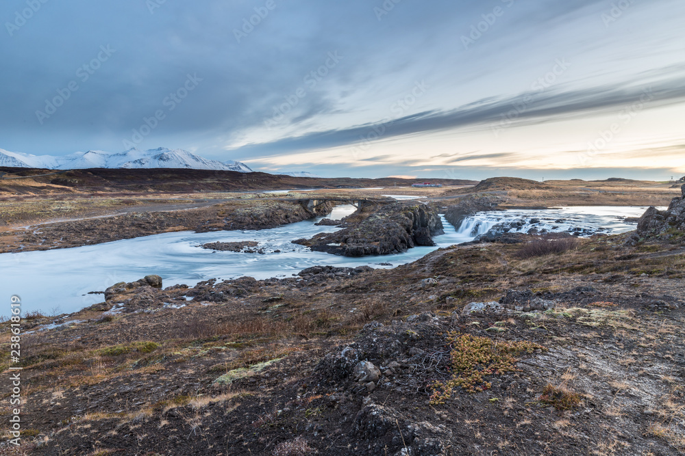 River landscape and fabulous waterfalls in Icelandic lands River landscape and fabulous waterfalls in Icelandic lands