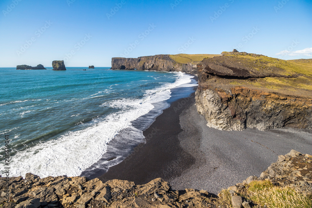 View over Kirkjufjara beach and stone arch, Iceland View over Kirkjufjara beach and stone arch, Iceland