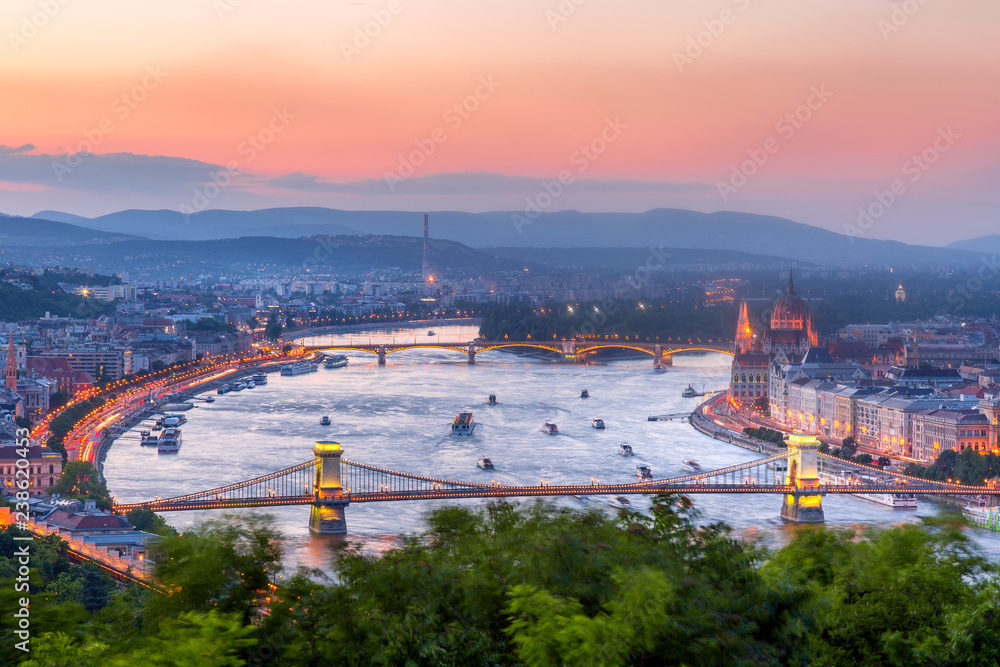 Budapest Panorama with parliament and bridges during evening twilight sunset. View from Citadel