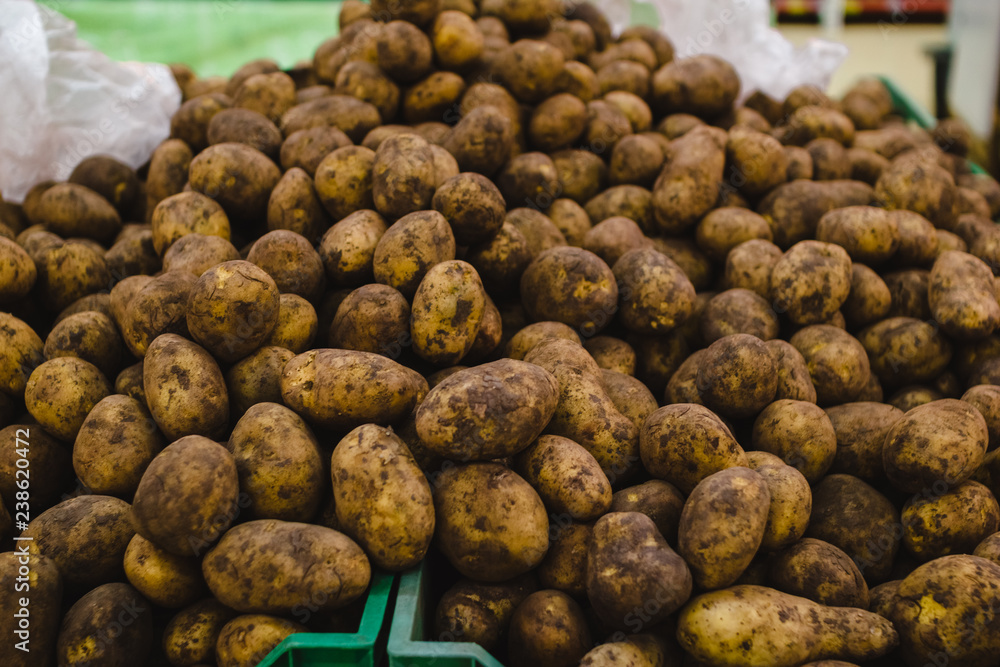 Closeup of a pile of potatoes on the box in the supermarket Closeup of a pile of potatoes on the box in the supermarket