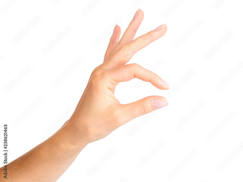 Woman hand holding something little with two fingers Woman hand holding something little with two fingers