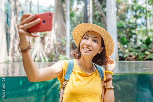 Happy visitor woman in botanical jungle tropical garden photo