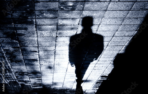 Blurry one man alone in the night shadow