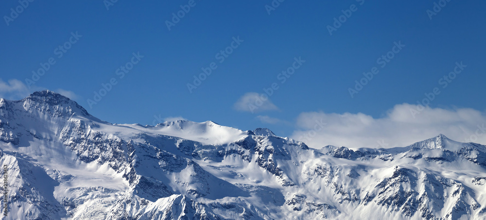Panoramic view on snowy sunlight mountains and glacier in nice sunny evening