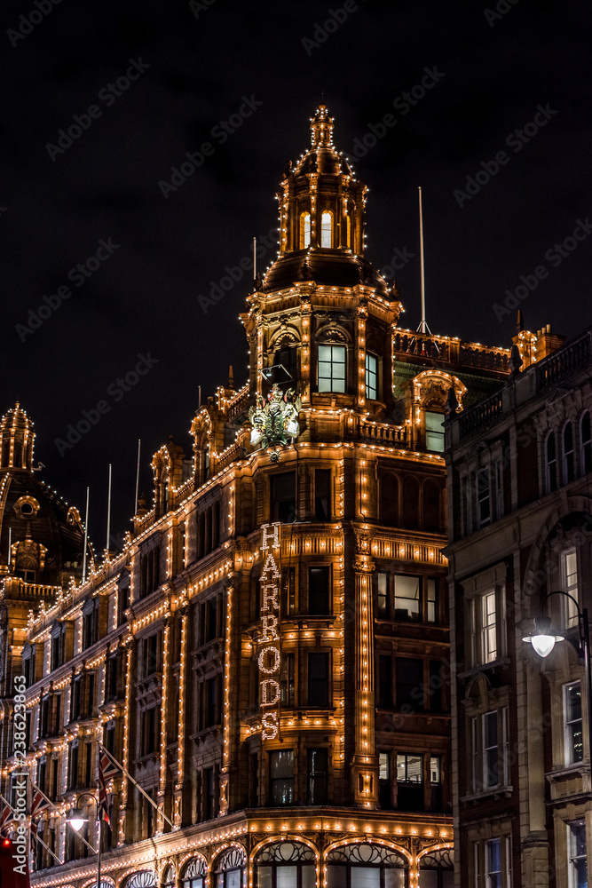 LONDON, UNITED KINGDOM - NOV 13, 2018: Night shoot, Harrods department store on Brompton Road in Knightsbridge. Christmas period.