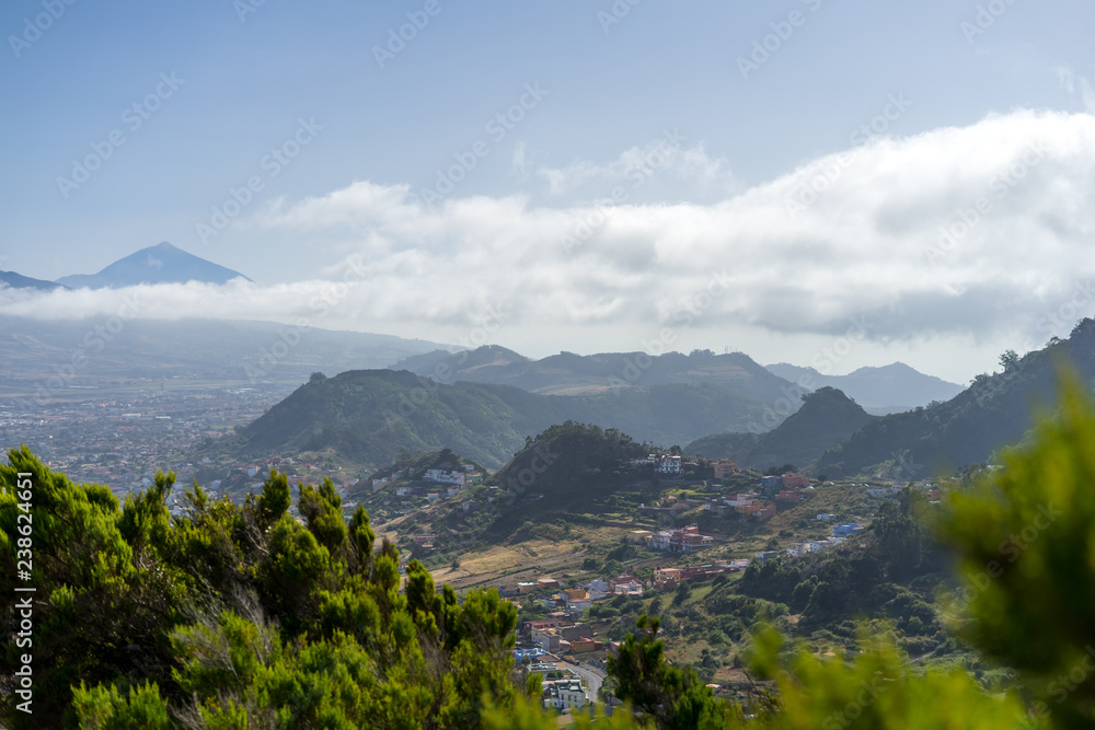 View of the valley, the old capital of the island of San Cristobal de La Laguna and the volcano Teide. Tenerife. Canary Islands. Spain. View from the observation deck - Mirador De Jardina.
