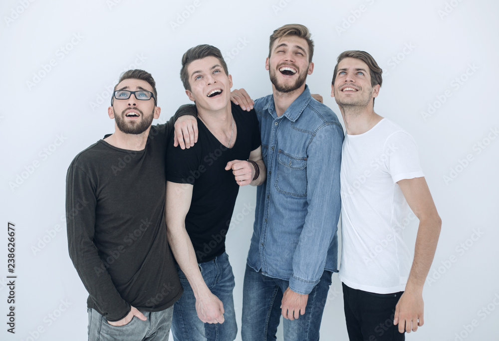 Obraz premium group of happy young men looking up