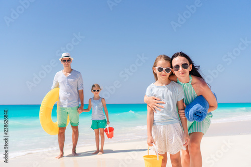 Portrait of happy family on a tropical beach © travnikovstudio