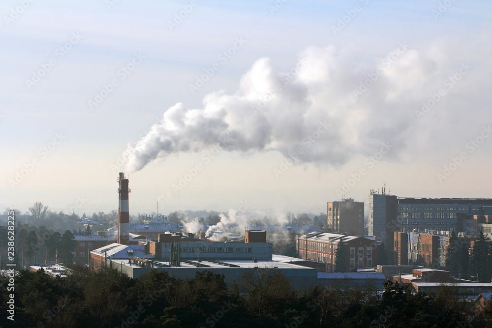 Factory in the city Ramenskoe. Russian industry. Cityscape. Smoke from the chimney and air pollution. Ecological problem