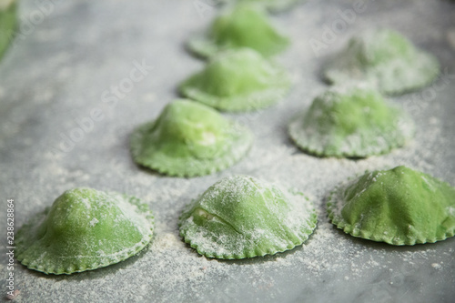 Green ravioli on table photo