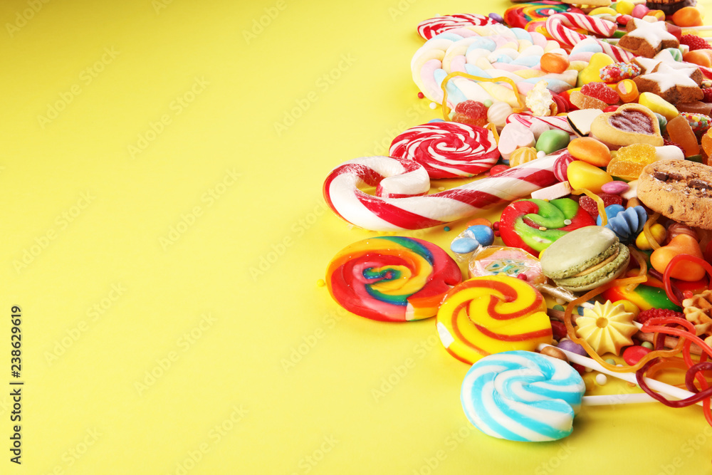 candies with jelly and sugar. colorful array of different childs sweets and treats. candies with jelly and sugar. colorful array of different childs sweets and treats.