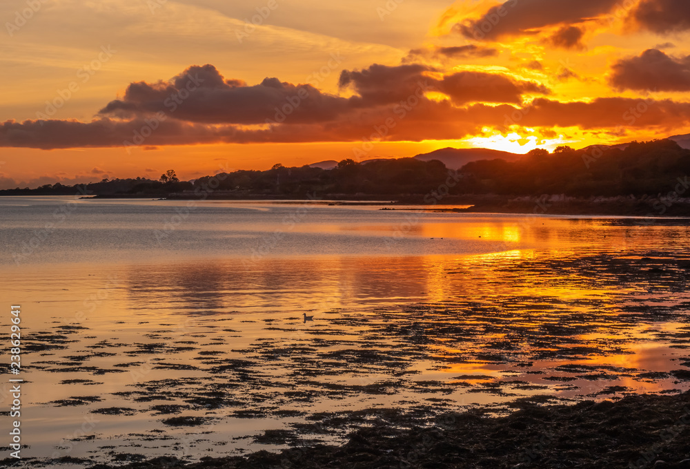 Beautiful sunset over the Kenmare bay from the harbour of the charming small town of Kenmare (the little nest), on the ring of kerry and the ring of Beara, in the south of County Kerry, Ireland.