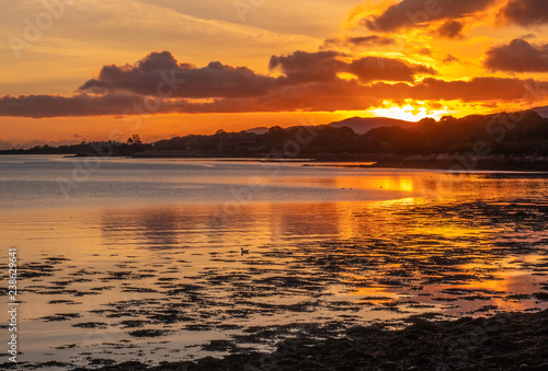Beautiful sunset over the Kenmare bay from the harbour of the charming small town of Kenmare  the little nest   on the ring of kerry and the ring of Beara  in the south of County Kerry  Ireland.