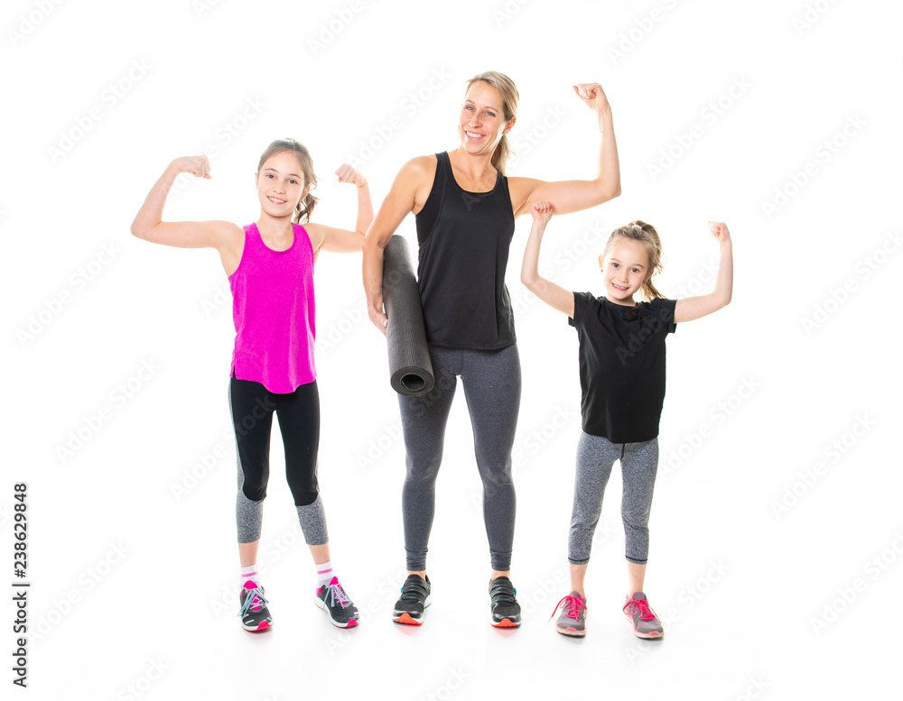 A Proud to be strong and healthy. Happy sporty family on studio white background A Proud to be strong and healthy. Happy sporty family on studio white background