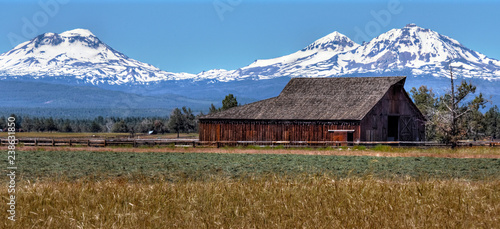 old barn in front of three sisters
