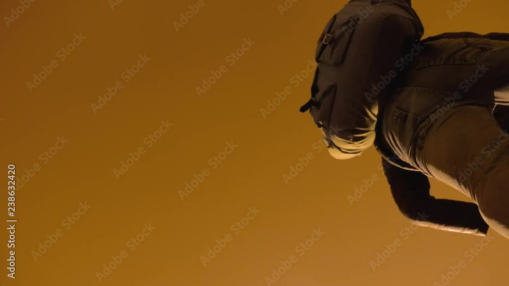 teamwork tourists business travel trip lends a helping hand. two men with backpacks hiking help each other silhouette in mountains with sunlight. slow motion video lifestyle. teamwork friendship