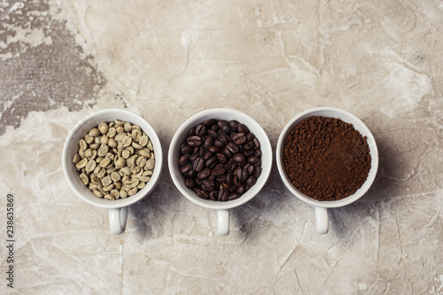 Different types of coffee - ground, grain and unroasted