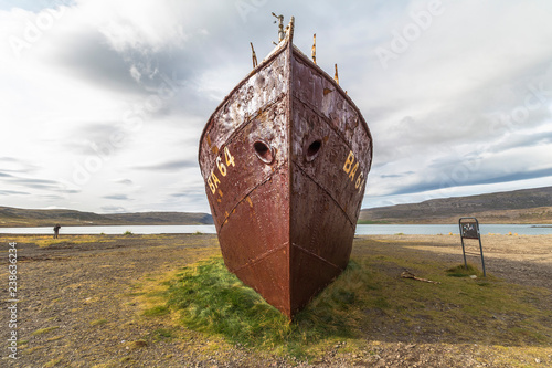 Wide angle view on impressive Ship wreck Gardar BA64 on west fjords, Iceland photo