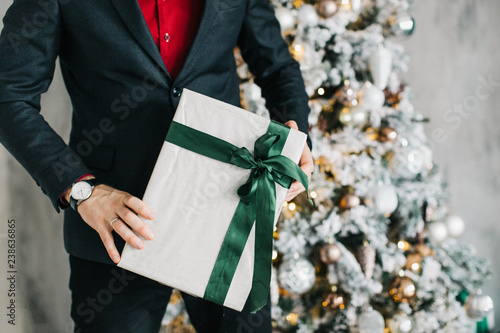 gift in the hands of a businessman, close-up