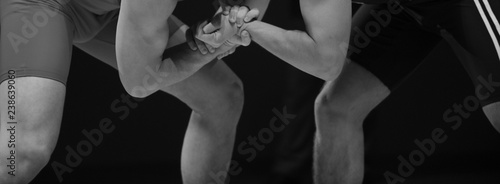 Two wrestlers Greco-Roman wrestling during competition photo