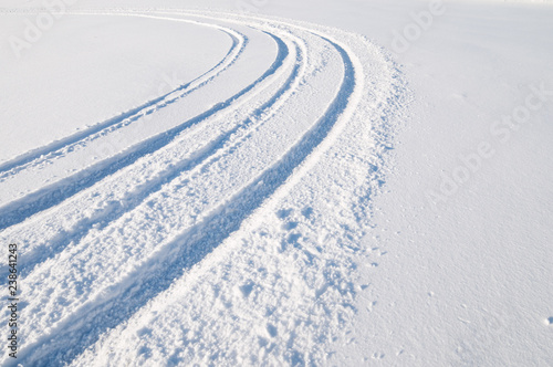 Tire tracks in fresh snow © ekim