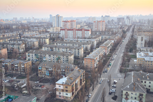 Aerial view of residential district with wonderful flaming sunset sky.View over the city rooftops with sunlight.Moderns buildings at Industrial uptown,residential neighbourhood