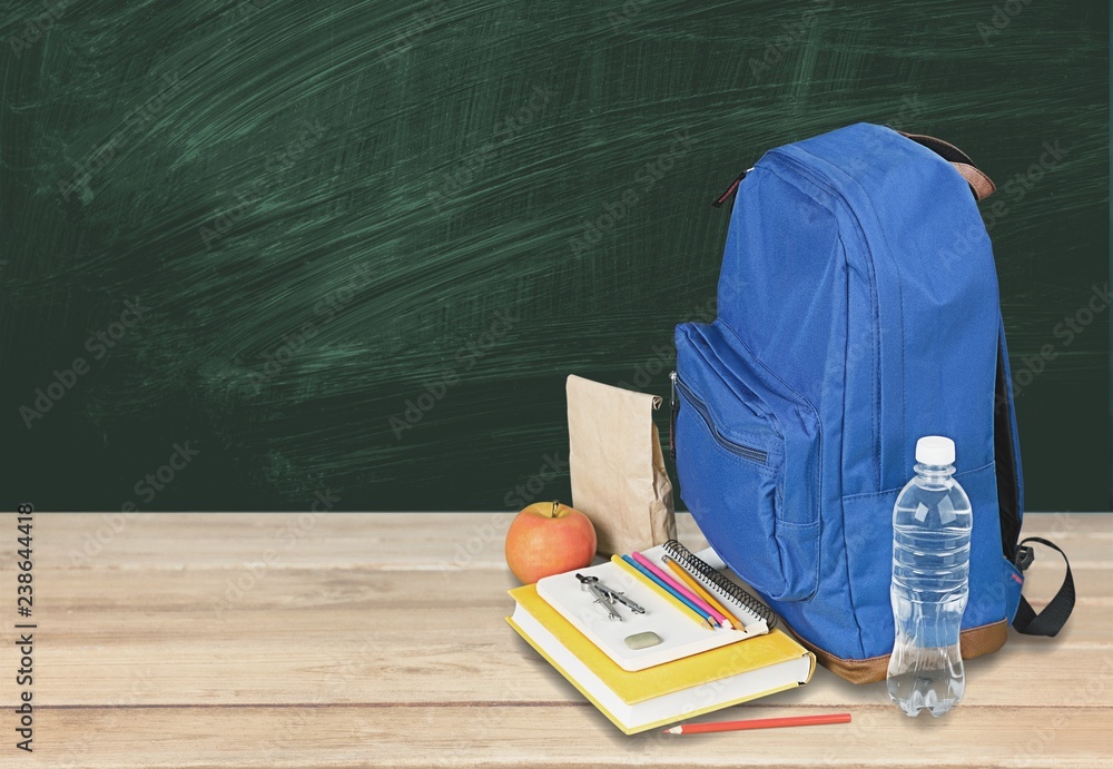 School Backpack with stationery on background School Backpack with stationery on background