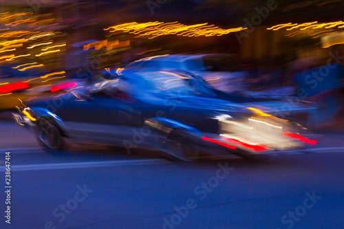 Impressions of a Car Speeding By City Neon Lights © WideAwake