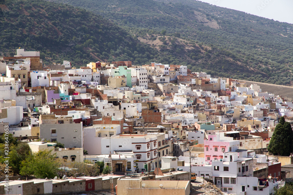 Africa, Northern Morocco, Rif Mountains, colorful,local village houses perched on hillside.