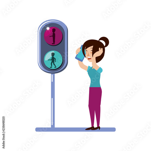 woman with smartphone and traffic light