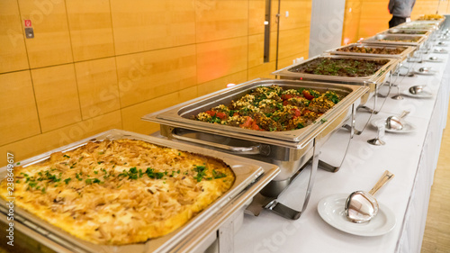 people group catering buffet food indoor in luxury restaurant with meat.