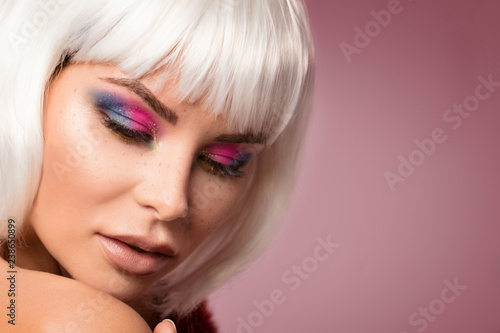 Beauty portrait, woman in colorful makeup.